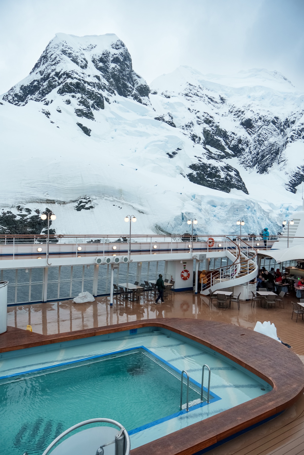 Silversea expedition ship pool deck surrounded by Antarctic mountains