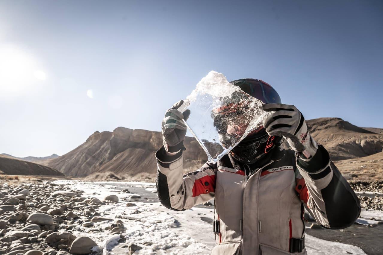 Motorcycle rider travelling through extreme conditions in Tibet